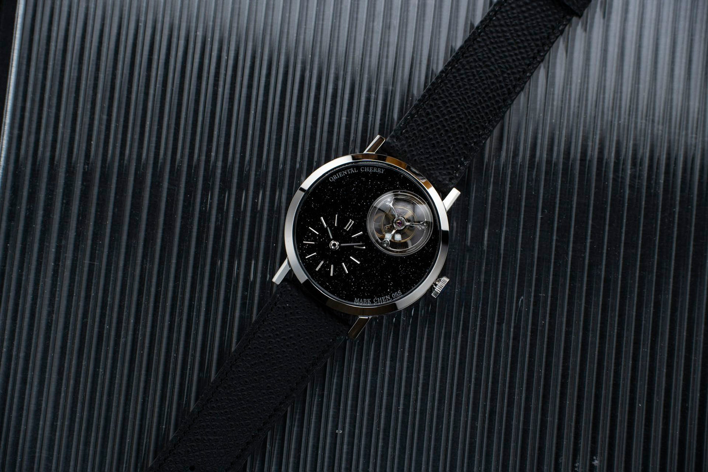 Mark Chen 05S · domed · black goldstone