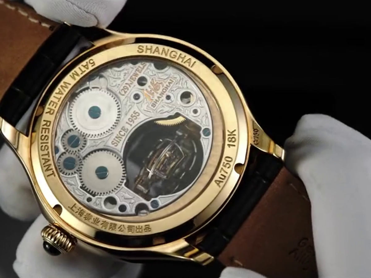 Globe Tourbillon · dual-axis · 18K gold case
