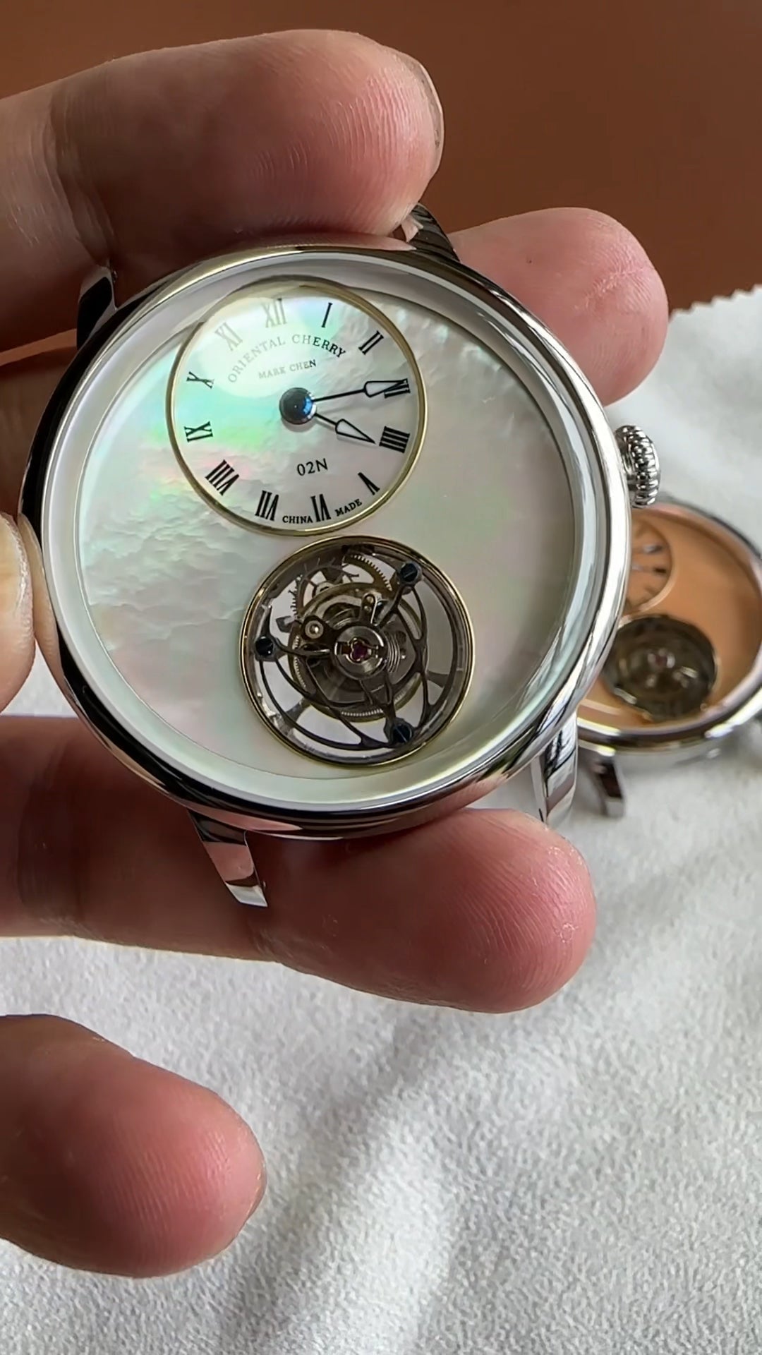 Mark Chen 02N · mother-of-pearl dial · engraved back