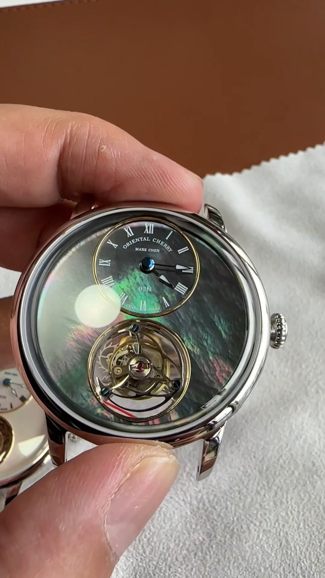 Mark Chen 02N · mother-of-pearl dial · engraved back