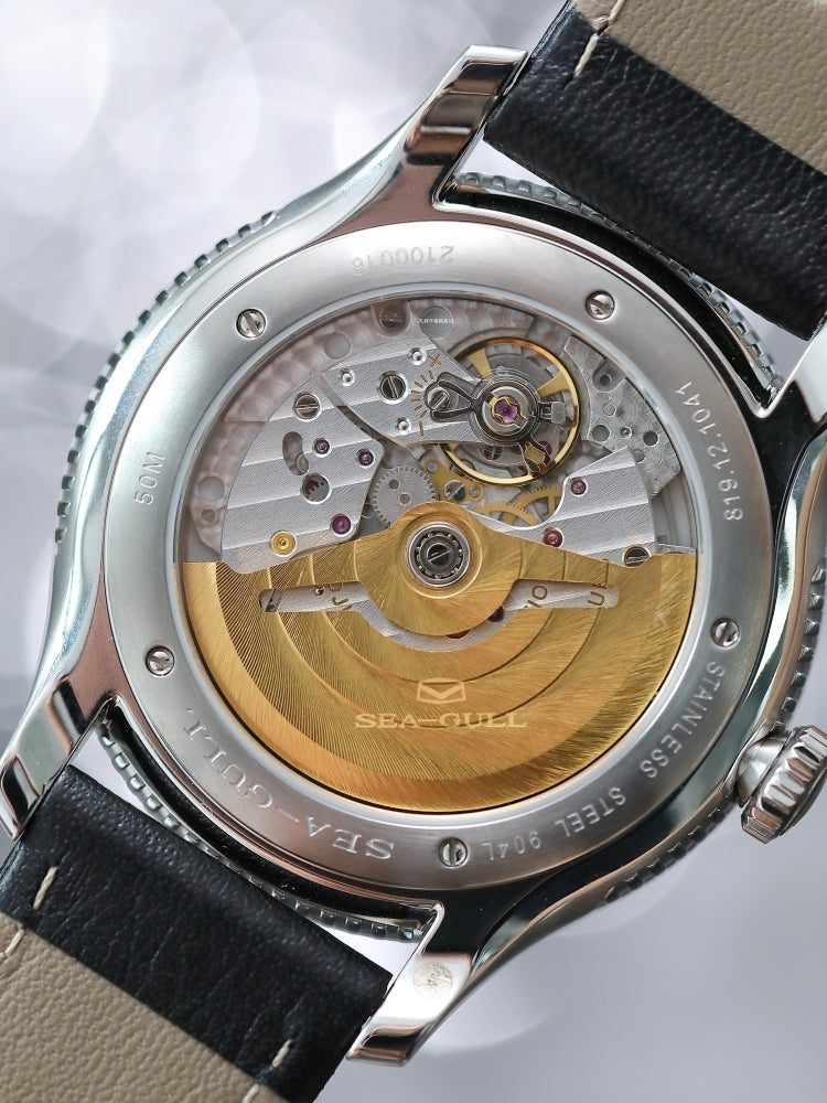 Designer Series · 904L steel · 18K gold logo
