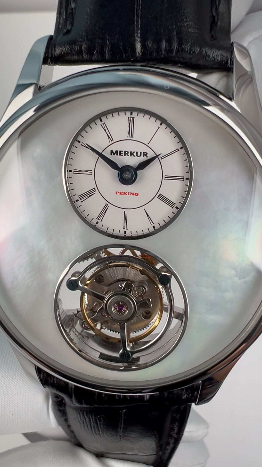 Tourbillon · white mother-of-pearl
