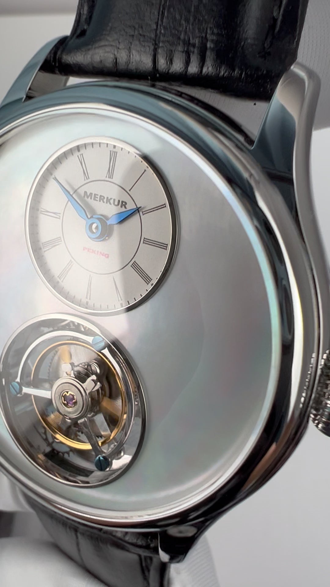 Tourbillon · white mother-of-pearl